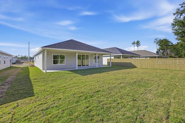 6726 Southwest 10th Lane Gainesville, FL 32607 - Photo 27 of 28 a view of a house with a backyard