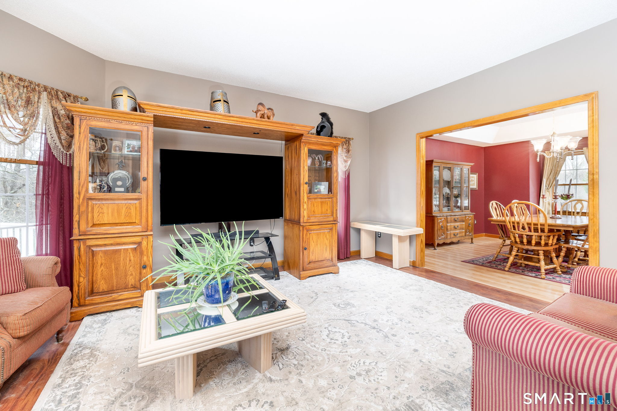 85 Salem Road East Haddam, CT 06415 - Photo 12 of 39 a living room with furniture a flat screen tv and a large window