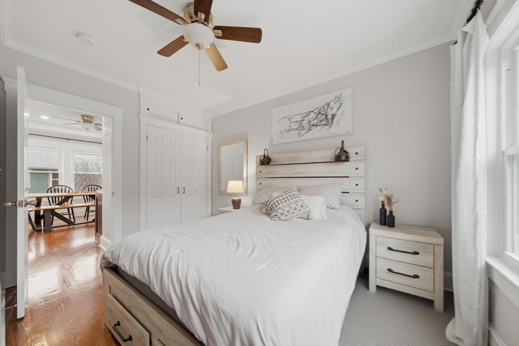 24 Prescott Street, Unit 3 Boston, MA 02136 - Photo 17 of 29 a bedroom with a bed and a chandelier