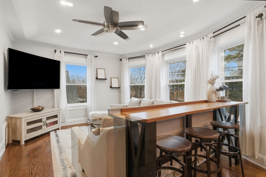 24 Prescott Street, Unit 3 Boston, MA 02136 - Photo 2 of 29 a living room with furniture and a flat screen tv