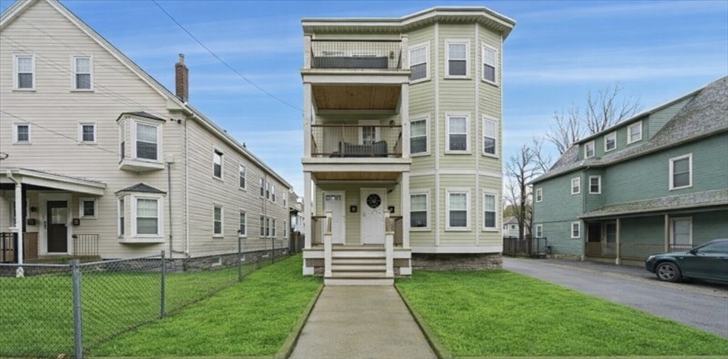 24 Prescott Street, Unit 3 Boston, MA 02136 - Photo 24 of 29 a front view of a house with a garden