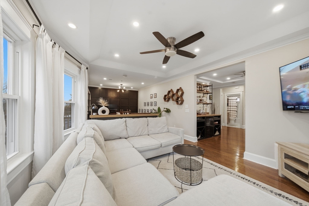 24 Prescott Street, Unit 3 Boston, MA 02136 - Photo 5 of 29 a living room with furniture and a flat screen tv