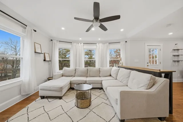 a living room with furniture and a window
