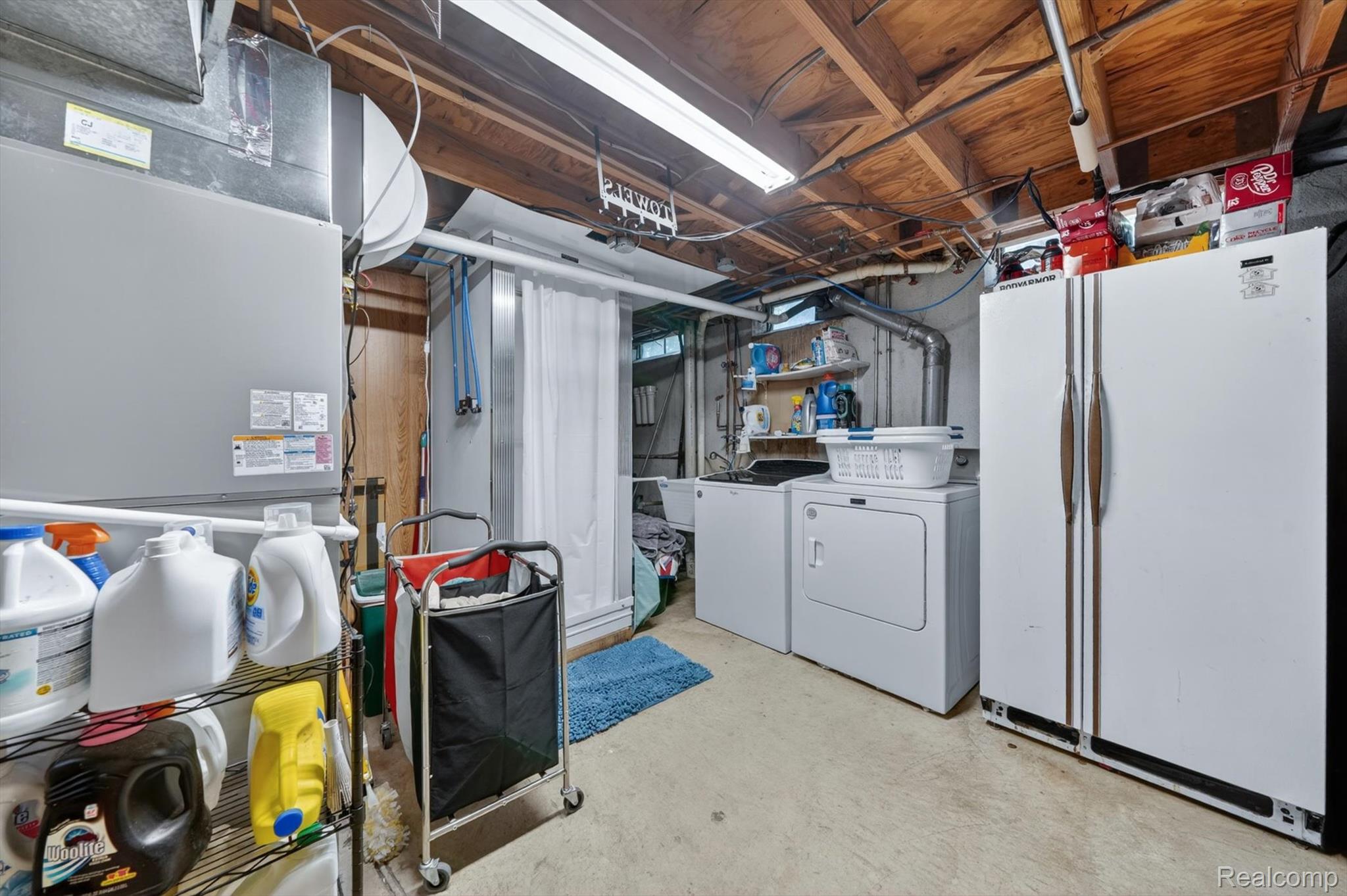 5469 Pheasant Run Road Clarkston, MI 48346 - Photo 28 of 36 Utility area featuring a washer, dryer, and an additional refrigerator