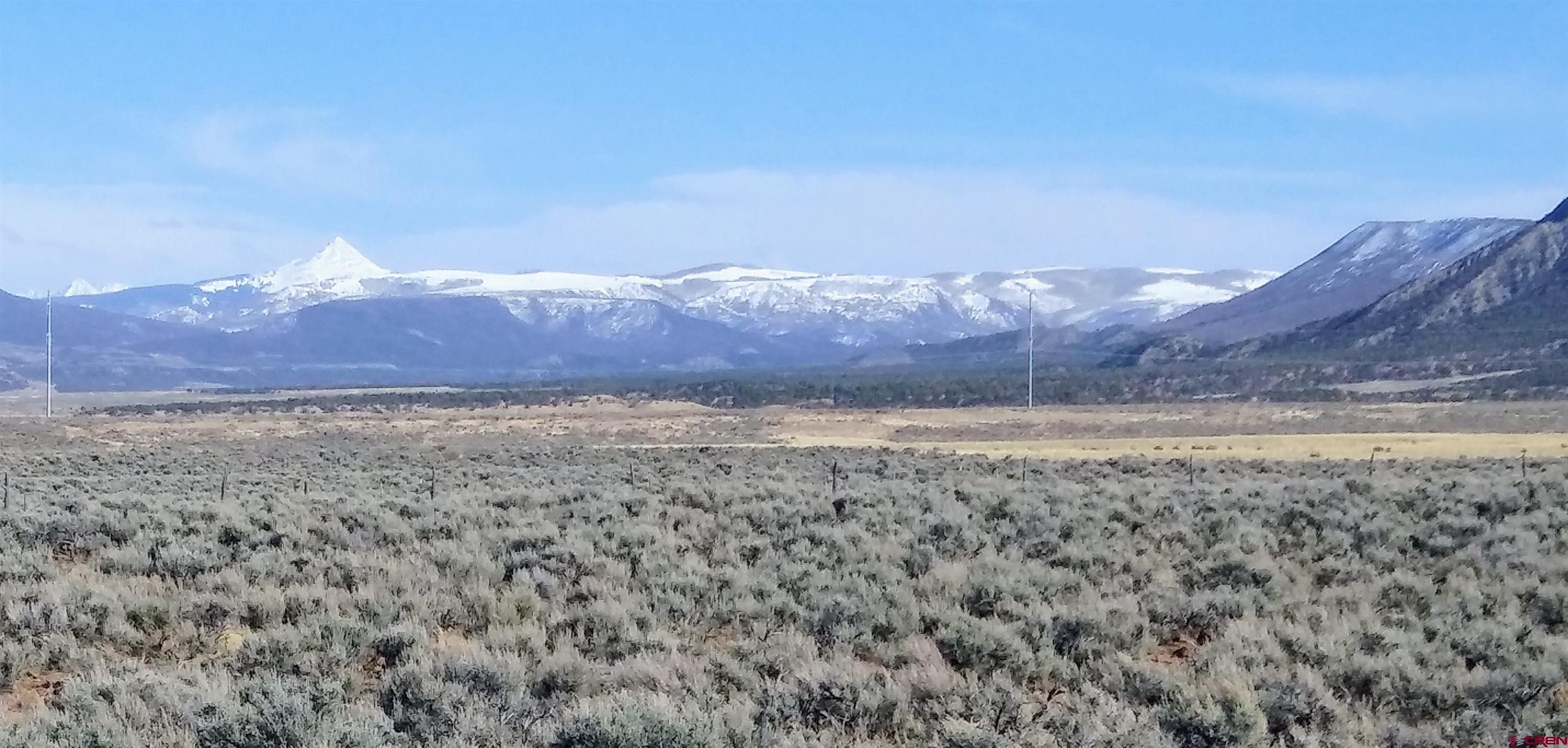 Tbd 25r Road Naturita, CO 81423 - Photo 9 of 16 a view of a yard with mountain