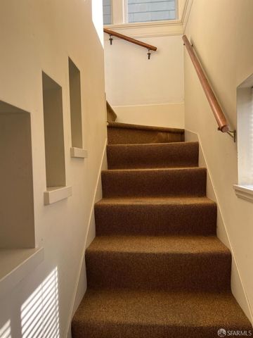 a view of house with wooden fence