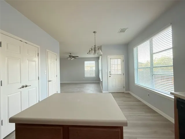 a kitchen with stainless steel appliances a stove sink and cabinets