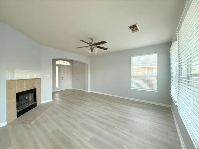 a kitchen with a refrigerator and a stove top oven