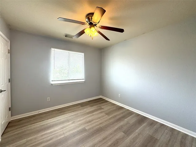 a bathroom with a double vanity sink a mirror and a bathtub