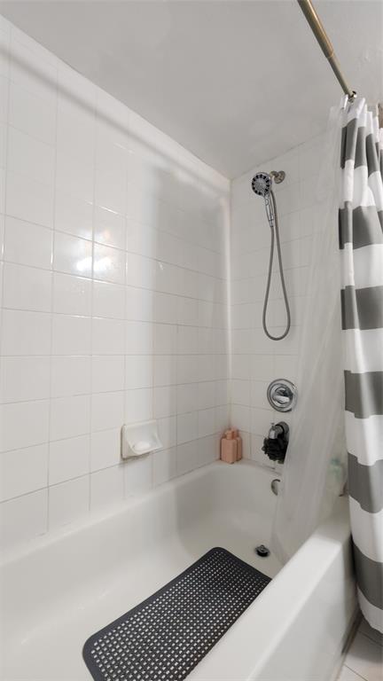 3874 Lyons Road, Unit 103 Pompano Beach, FL 33073 - Photo 12 of 27 a bathroom with a bathtub and shower