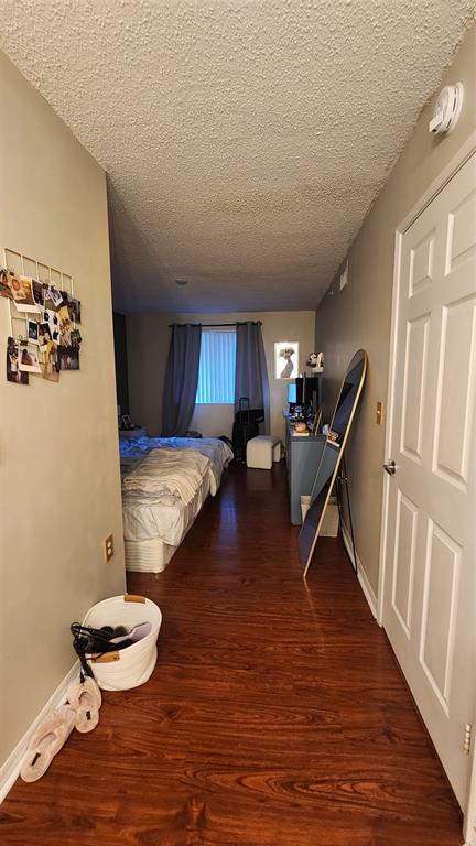 3874 Lyons Road, Unit 103 Pompano Beach, FL 33073 - Photo 19 of 27 a living room with furniture and a wooden floor