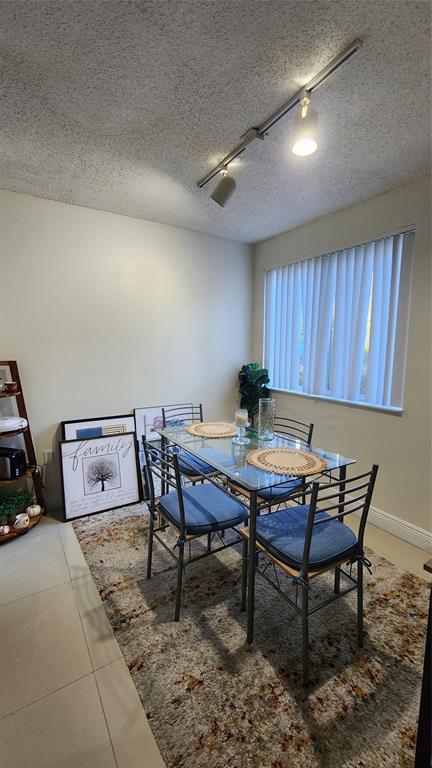 3874 Lyons Road, Unit 103 Pompano Beach, FL 33073 - Photo 23 of 27 a view of a workspace with furniture