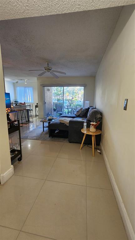 3874 Lyons Road, Unit 103 Pompano Beach, FL 33073 - Photo 6 of 27 a kitchen with a sink and a stove top oven