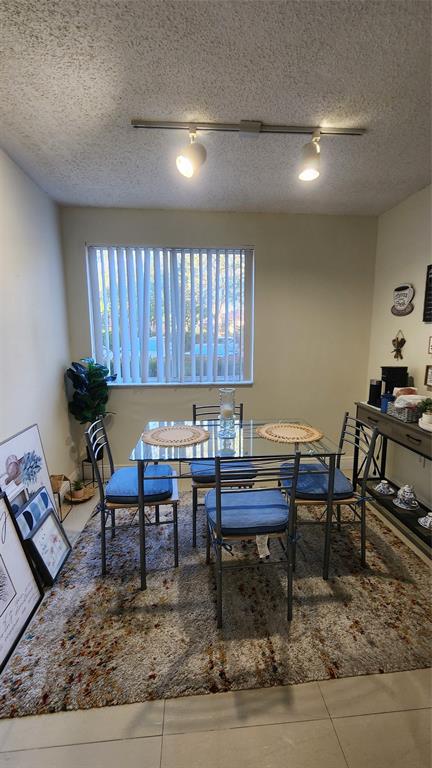 3874 Lyons Road, Unit 103 Pompano Beach, FL 33073 - Photo 8 of 27 a view of a work space with furniture