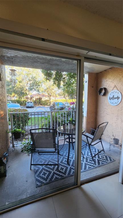 3874 Lyons Road, Unit 103 Pompano Beach, FL 33073 - Photo 9 of 27 a living room with furniture