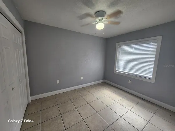 a view of an empty room with a window