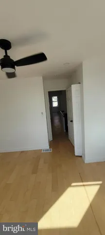 a bedroom with a bed and a lamp