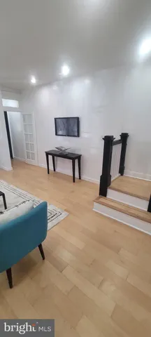 a lobby with furniture and stairs