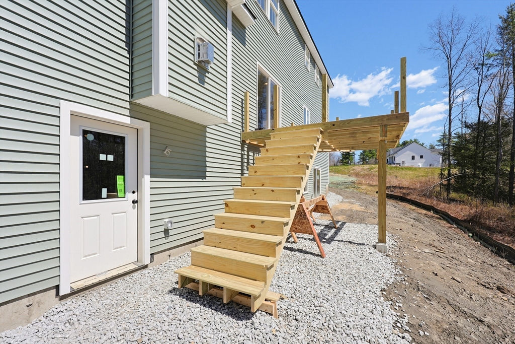112 West Meadow Road Townsend, MA 01474 - Photo 35 of 38 a view of a house with a yard and stairs