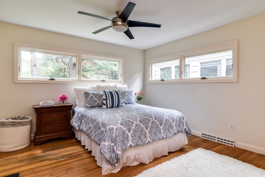 2 Hilltop Road Dover, MA 02030 - Photo 15 of 23 a bedroom with a bed and wooden floor