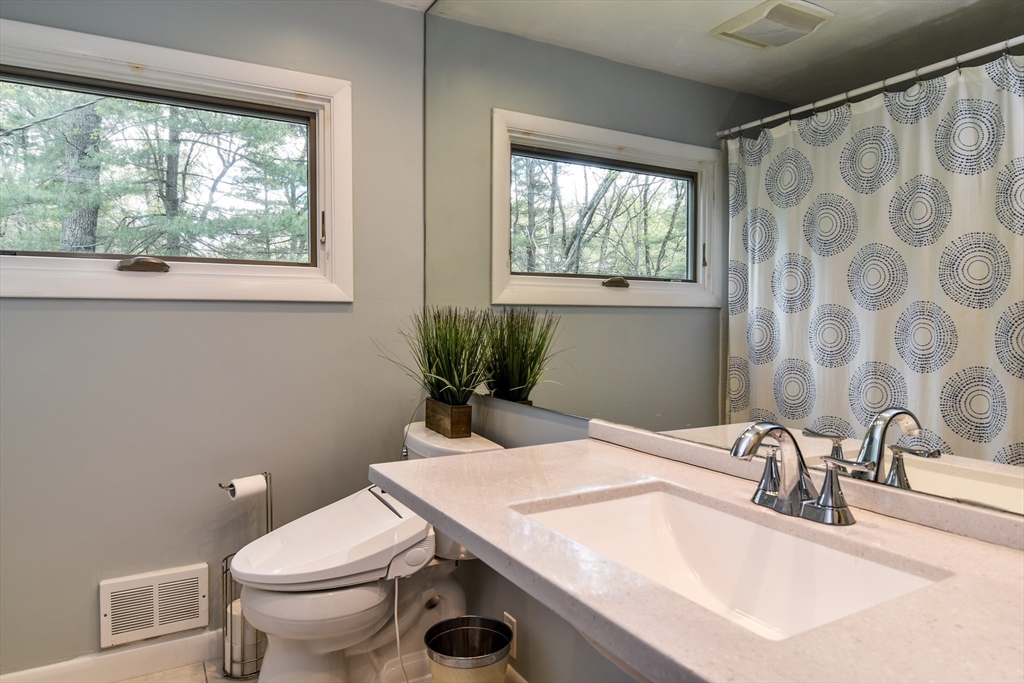 2 Hilltop Road Dover, MA 02030 - Photo 18 of 23 a bathroom with a granite countertop sink and a toilet