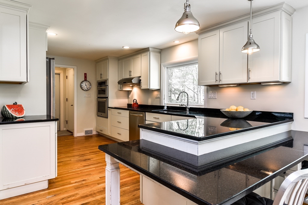 2 Hilltop Road Dover, MA 02030 - Photo 8 of 23 a kitchen with stainless steel appliances granite countertop a sink dishwasher a refrigerator and a stove with wooden floor