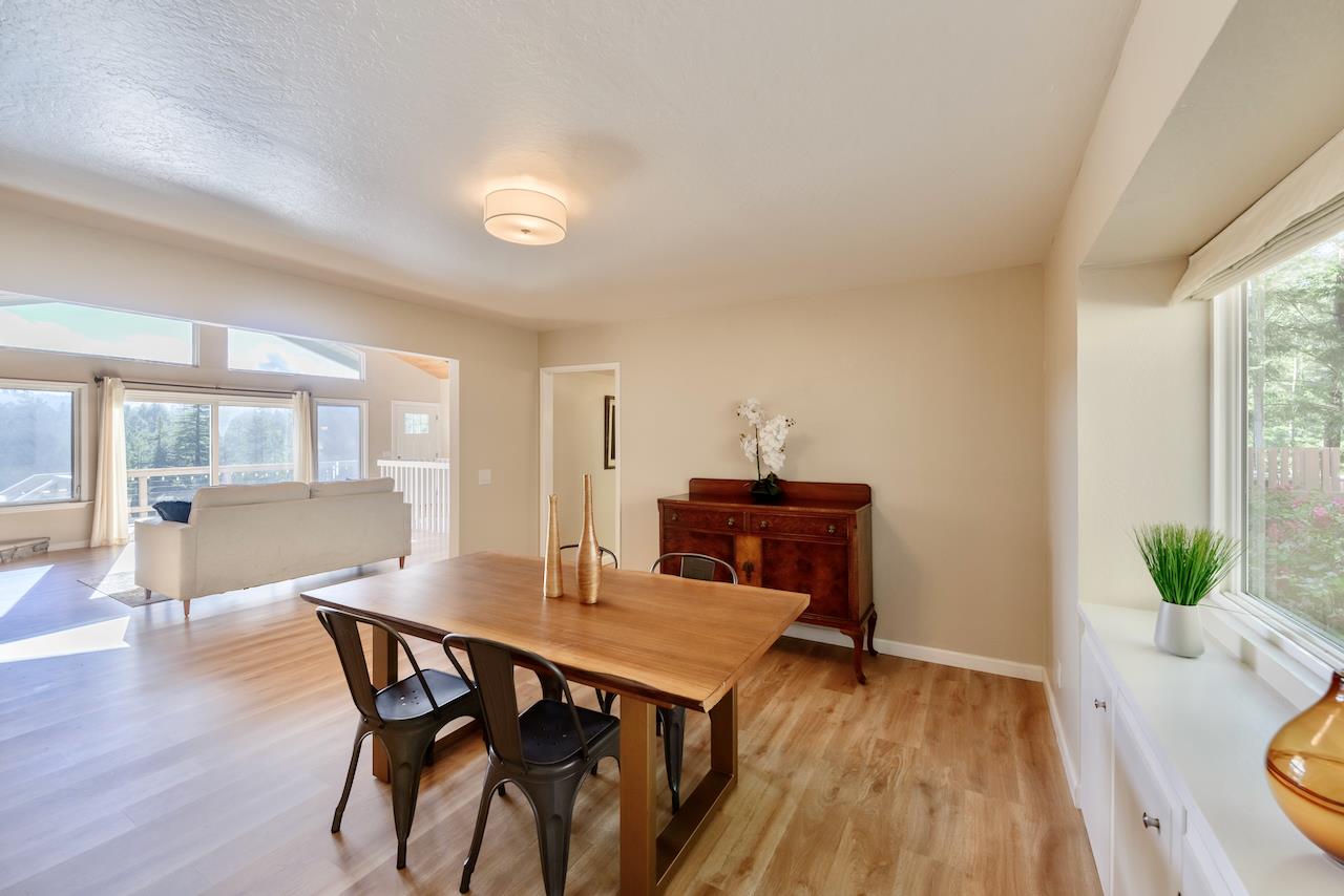 155 Rabbits Run Road Santa Cruz, CA 95060 - Photo 24 of 113 a view of a dining room with furniture and wooden floor