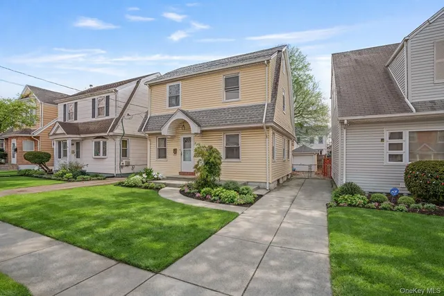 a front view of a house with a yard