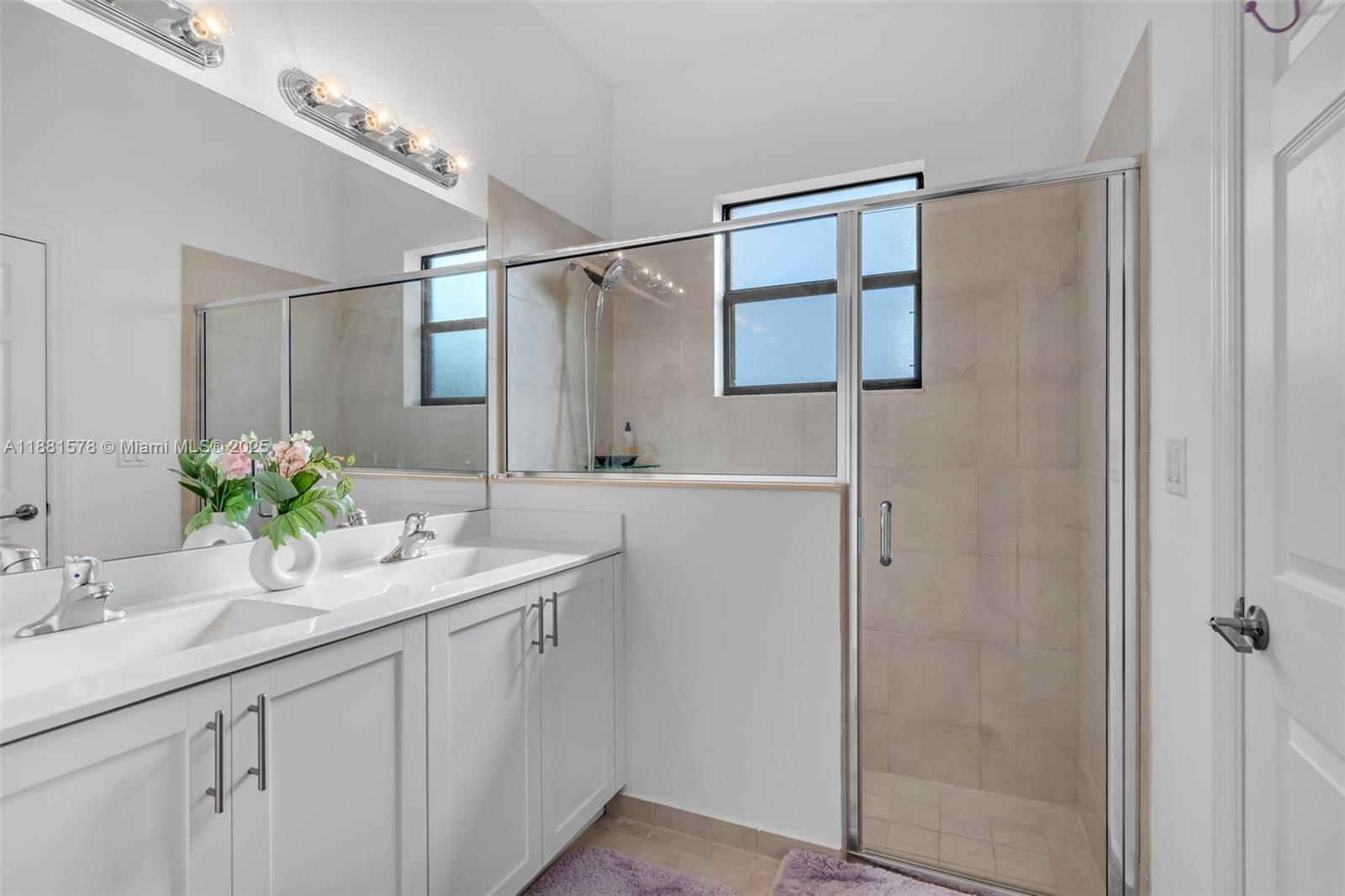 Ives Estates Miami, FL 33179 - Photo 11 of 25 a bathroom with a sink and a mirror