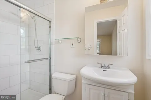 a bedroom with a bed and a potted plant