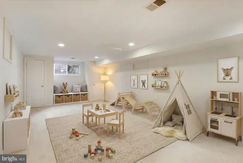 a spacious bedroom with a bed a couch and a bookshelf with wooden floor