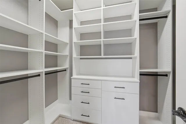a view of an empty walk in closet