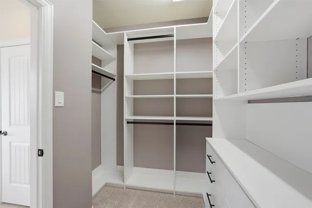 a room with closet and a window