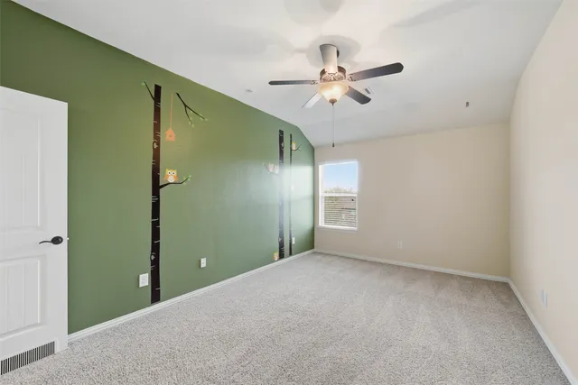 a view of a big room with windows and closet