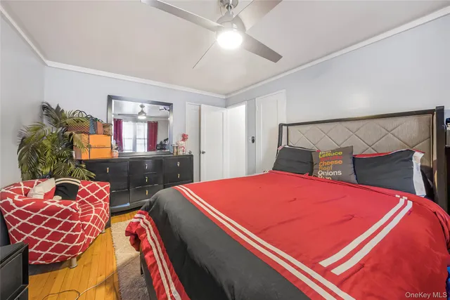 a bedroom with bed and a dresser