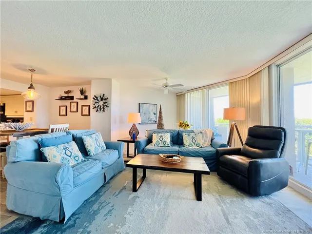a view of a chairs and table in patio with plants