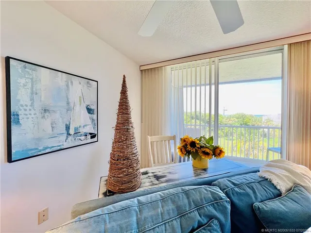 a view of a chairs and table in patio