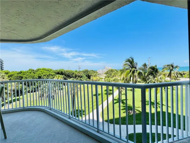 a bedroom with bed and balcony