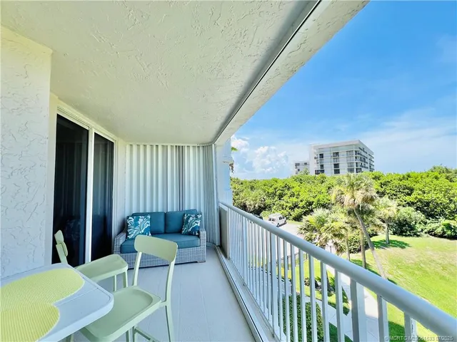 a bathroom with a tub sink double vanity and mirror