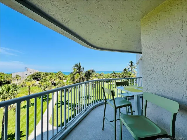 a spacious bathroom with a double vanity sink a mirror and a toilet