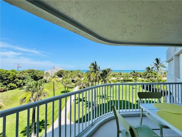 a bathroom with a granite countertop sink mirror vanity and bathtub