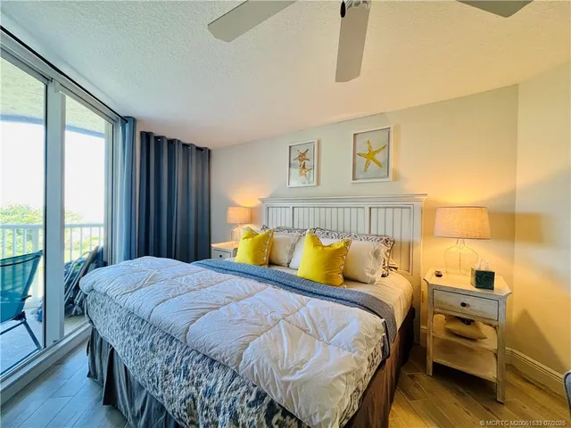 a aerial view of a house with a yard and lake view