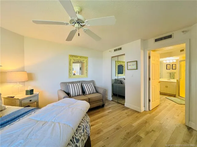 a view of a swimming pool with outdoor seating