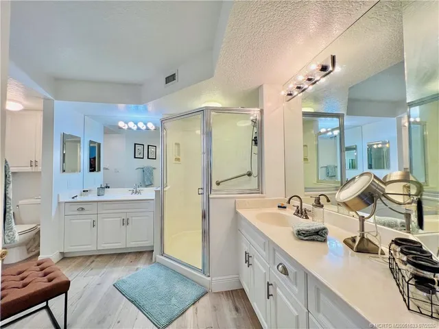 a view of a balcony with wooden floor