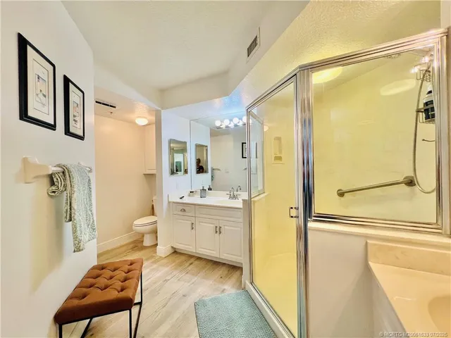 a living room with furniture a chandelier and a dining table view