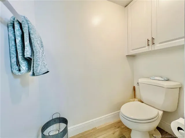 a living room with furniture a dining table and chairs