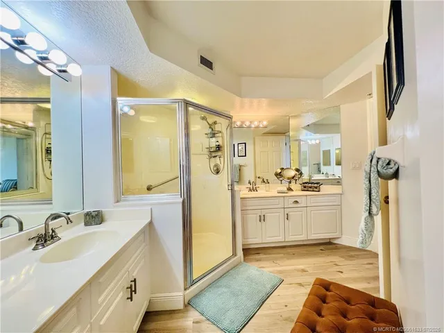 a living room with patio furniture and a flat screen tv