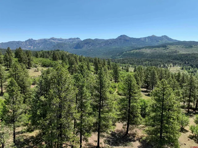 a view of a town with mountains in the background