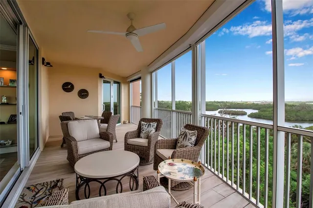 a balcony with furniture and wooden floor