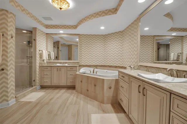 a large bathroom with a double vanity sink and mirror